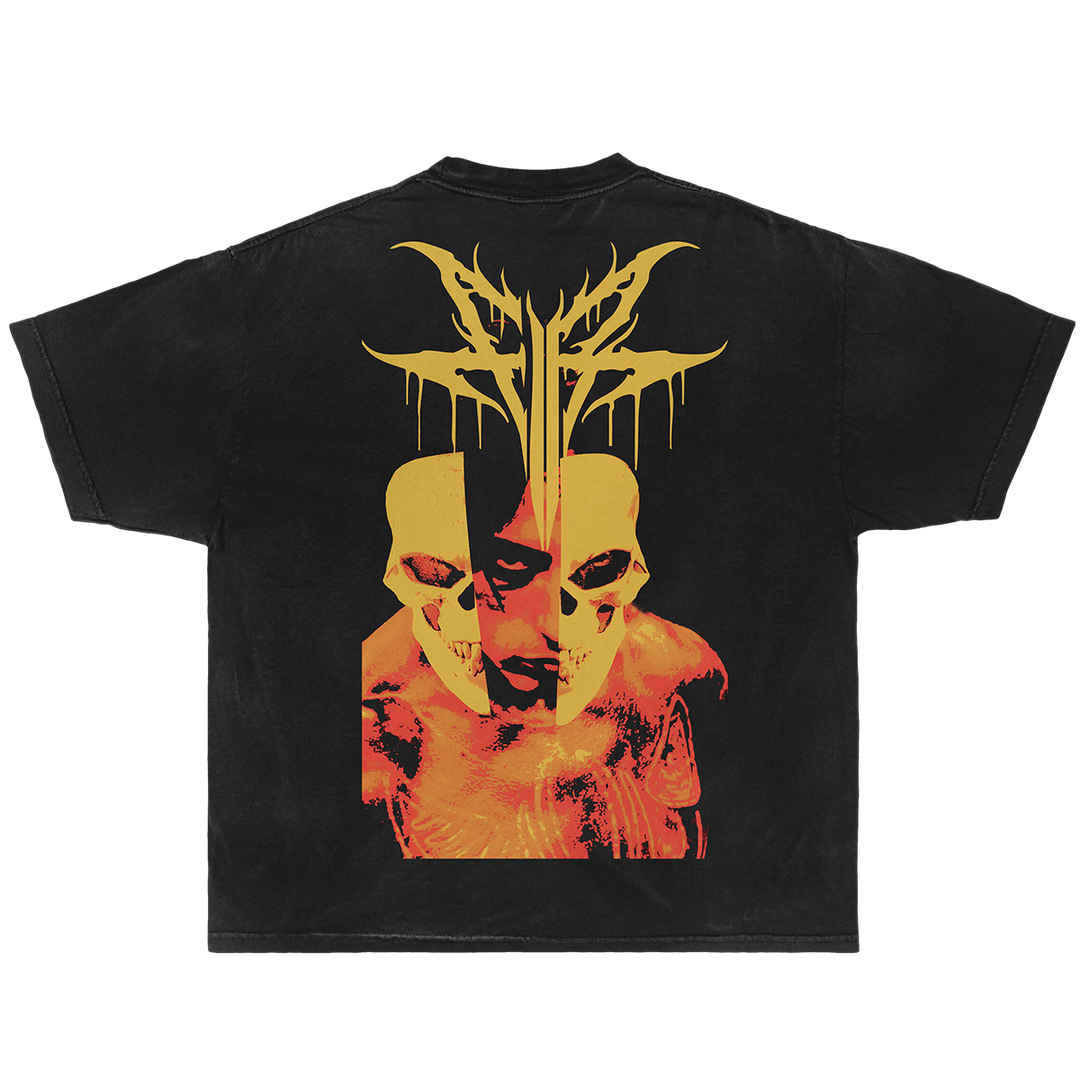A black short-sleeve t-shirt featuring a large graphic print on the back with two yellow skulls, a split face, and a yellow thorn-like crown above.